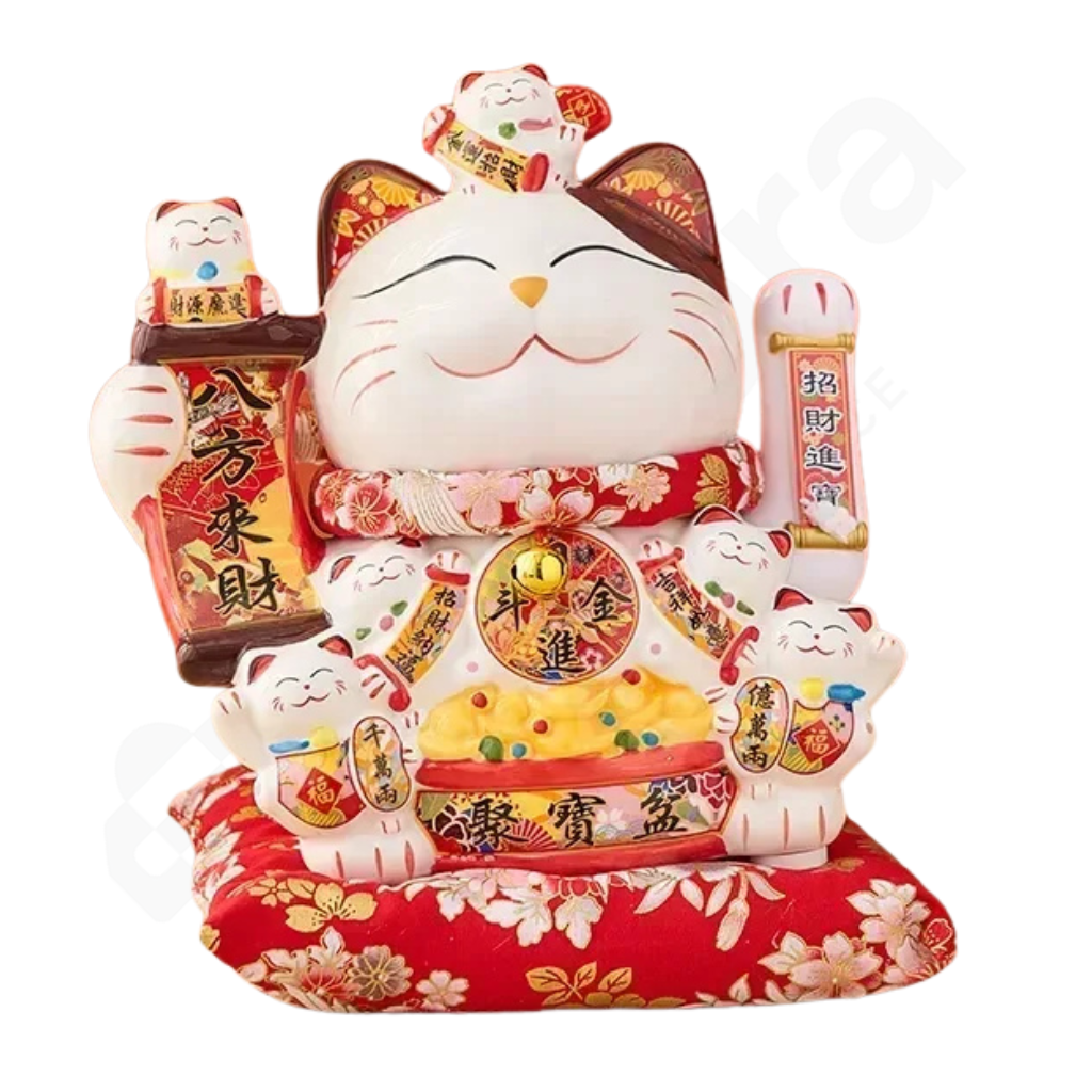 Decorative cat figurine with red base on a white background