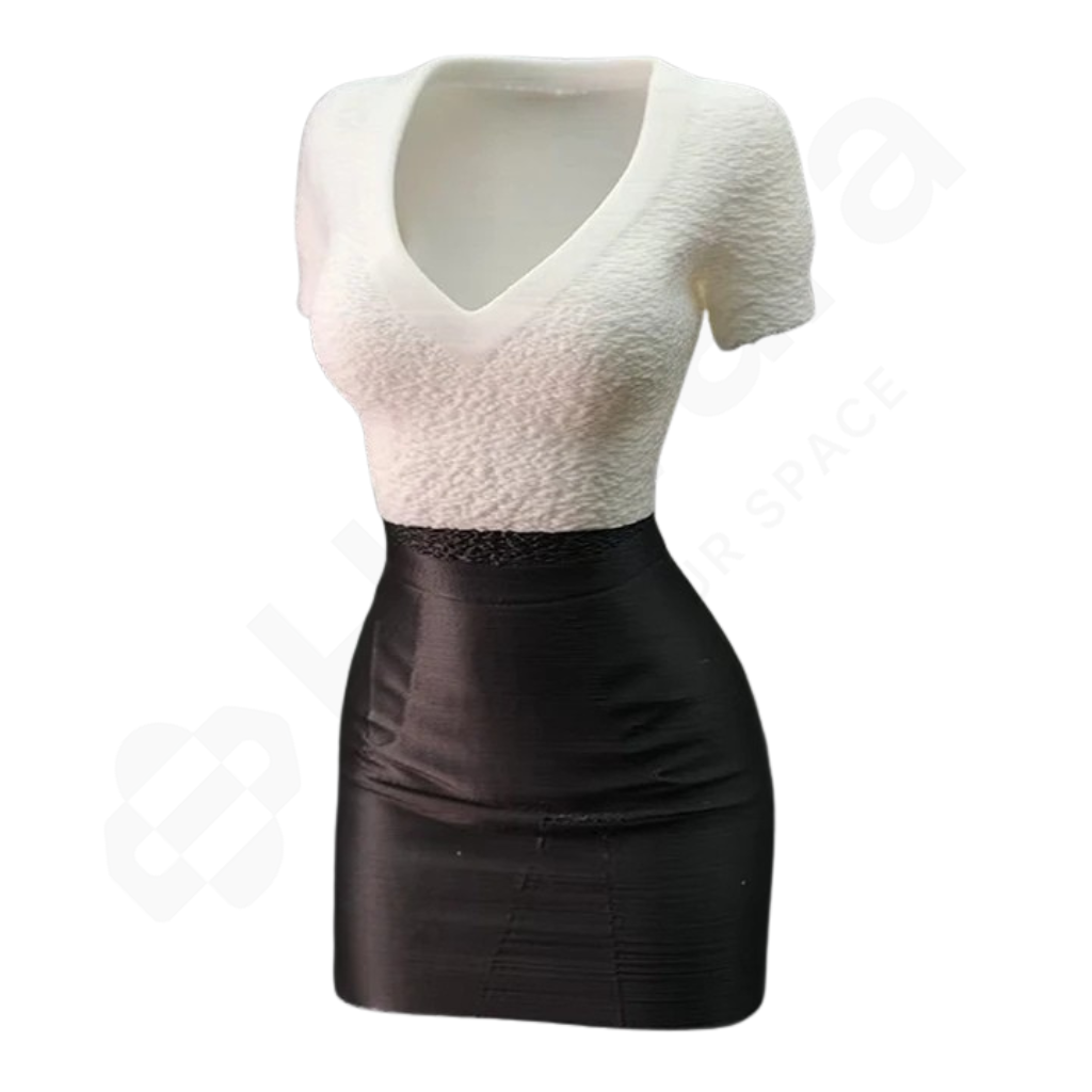 Two-tone dress with white top and black skirt on a white background