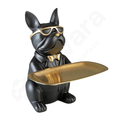 Black dog figurine with gold sunglasses and tray on a white background