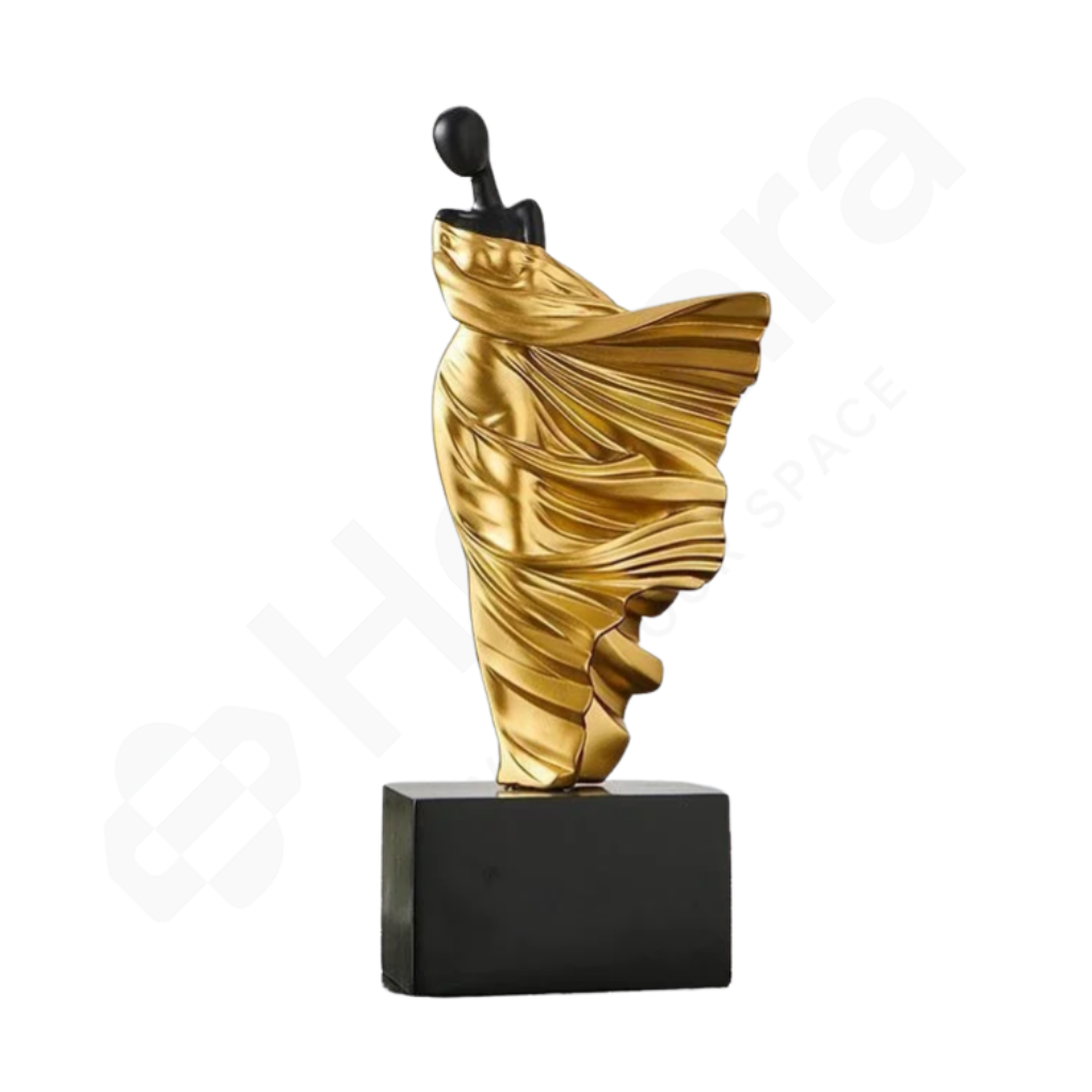 Gold and black sculpture on a white background