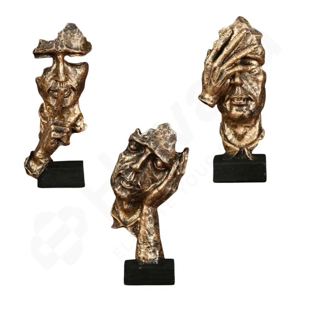 Three bronze sculptures of stylized faces on black bases against a white background