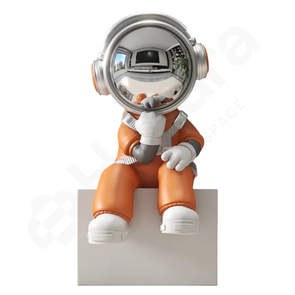 Spaceman figurine with orange suit and silver helmet on a white background