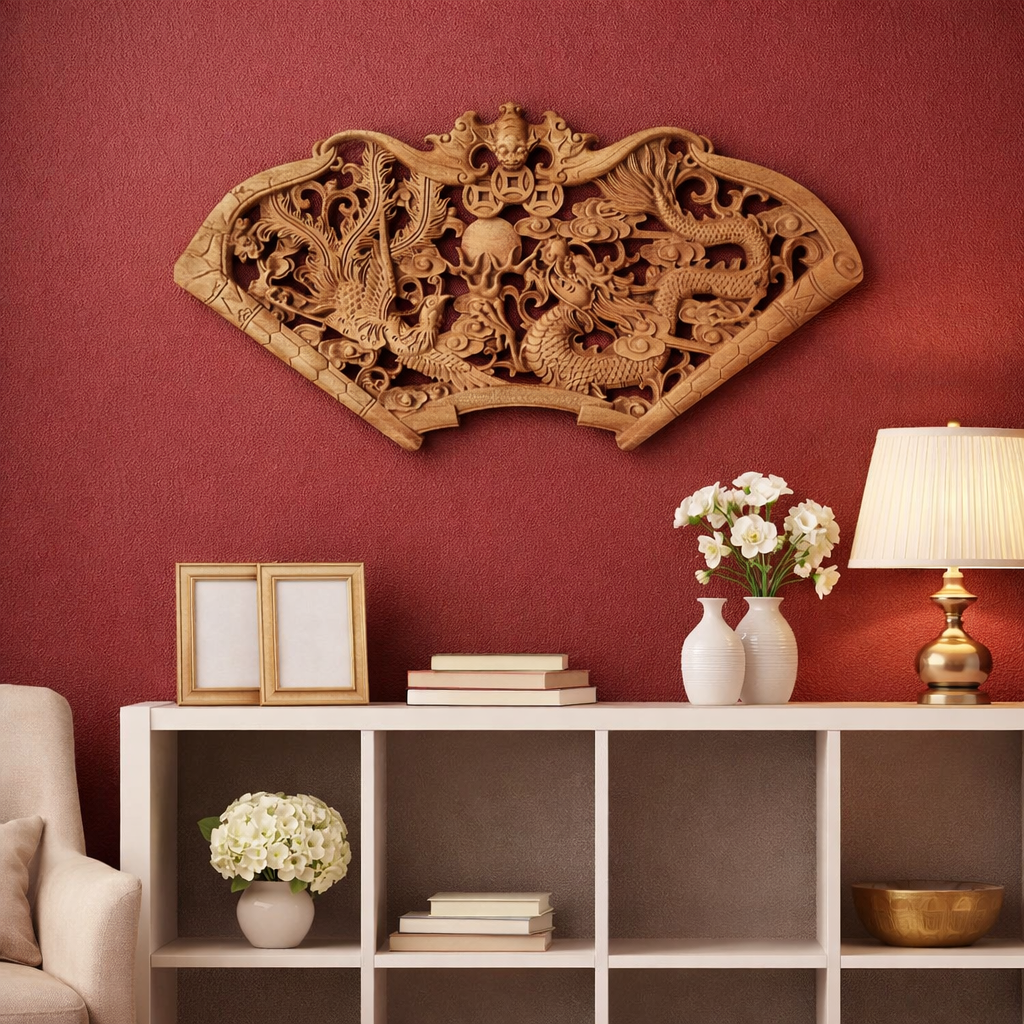 Decorative wooden wall panel with intricate carvings on a red wall above a white shelf.
