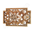 Wooden decorative panel with intricate carvings on a white background