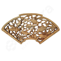 Wooden decorative panel with intricate carvings of fish on a white background