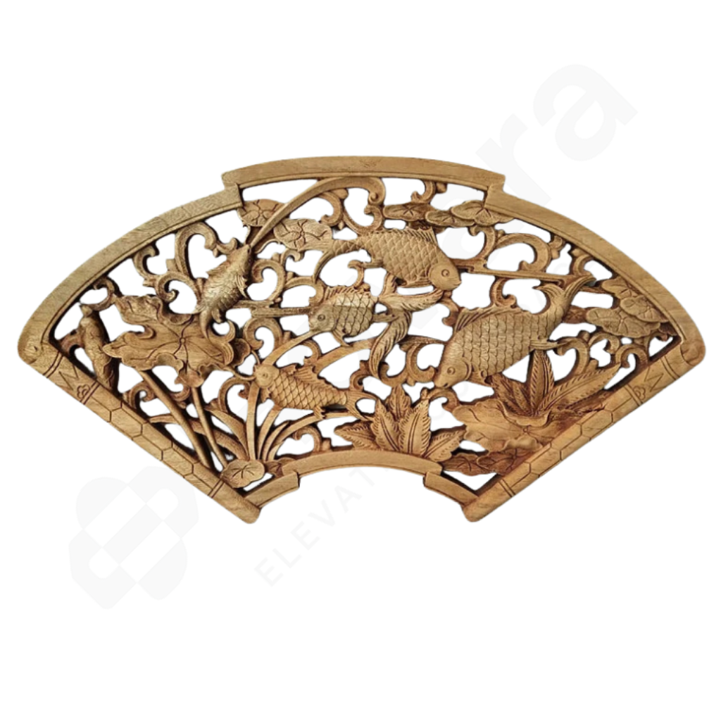 Wooden decorative panel with intricate carvings of fish on a white background