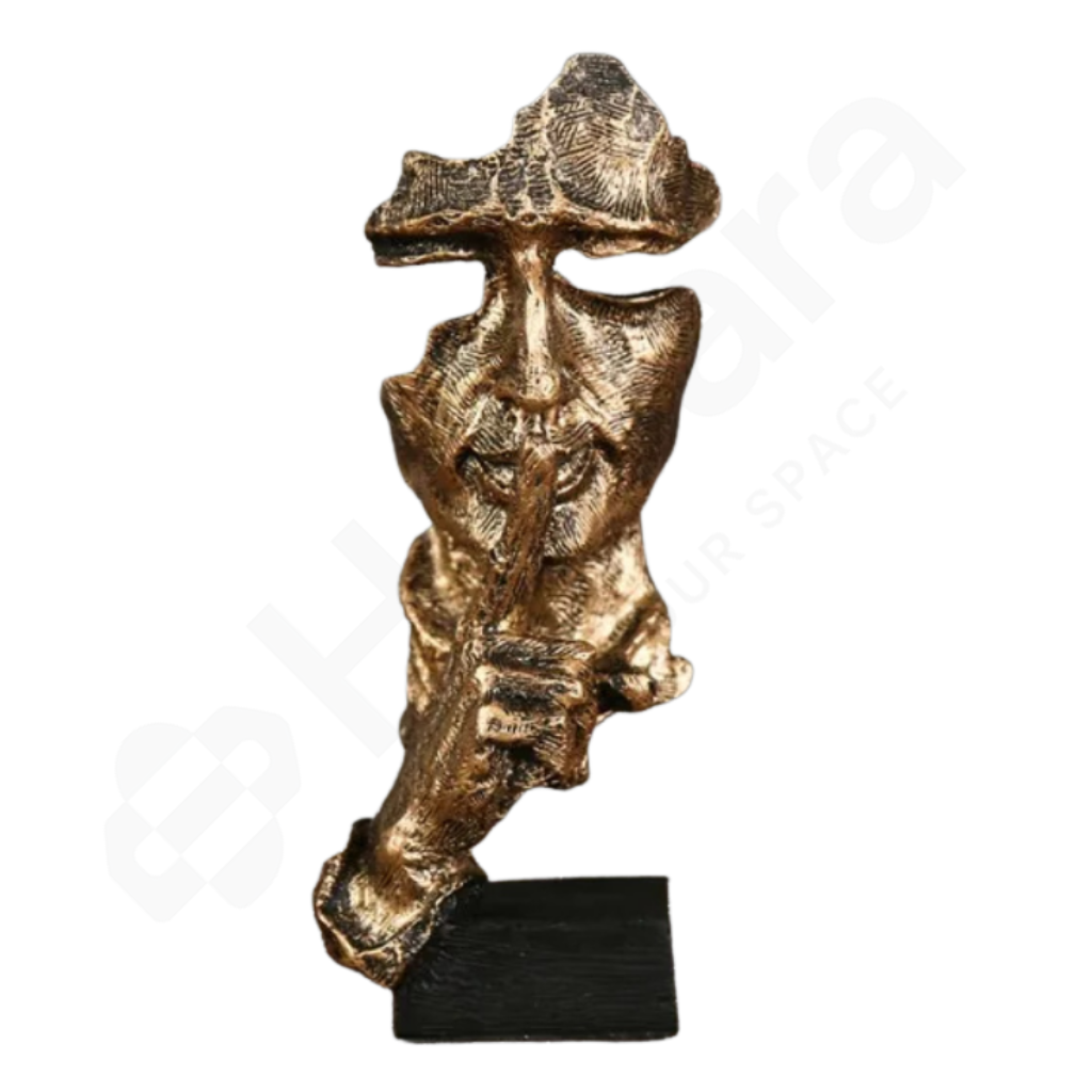 Bronze sculpture of a figure with a hat on a white background