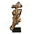 Bronze sculpture of a figure with a hat on a white background