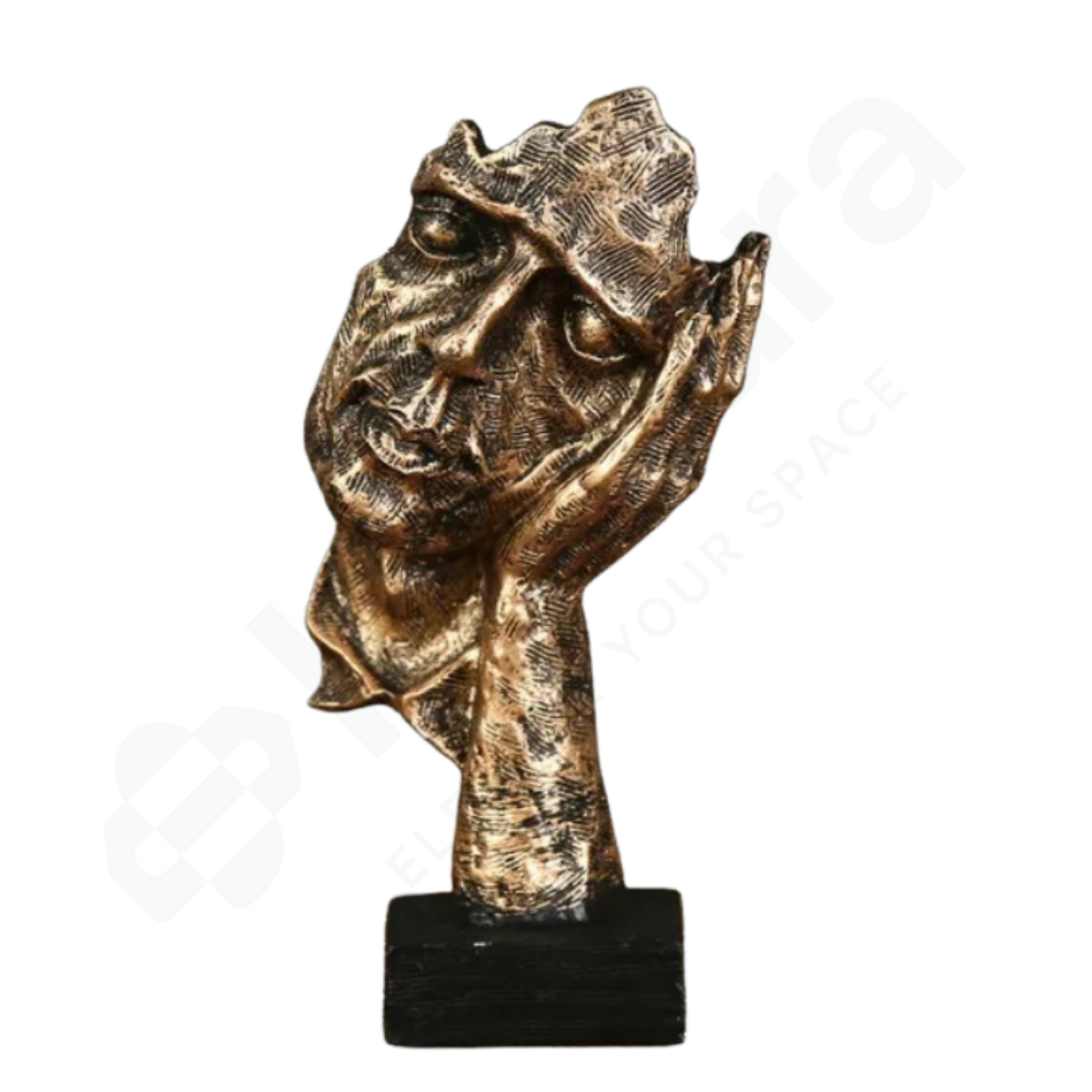 Bronze sculpture of a face on a white background