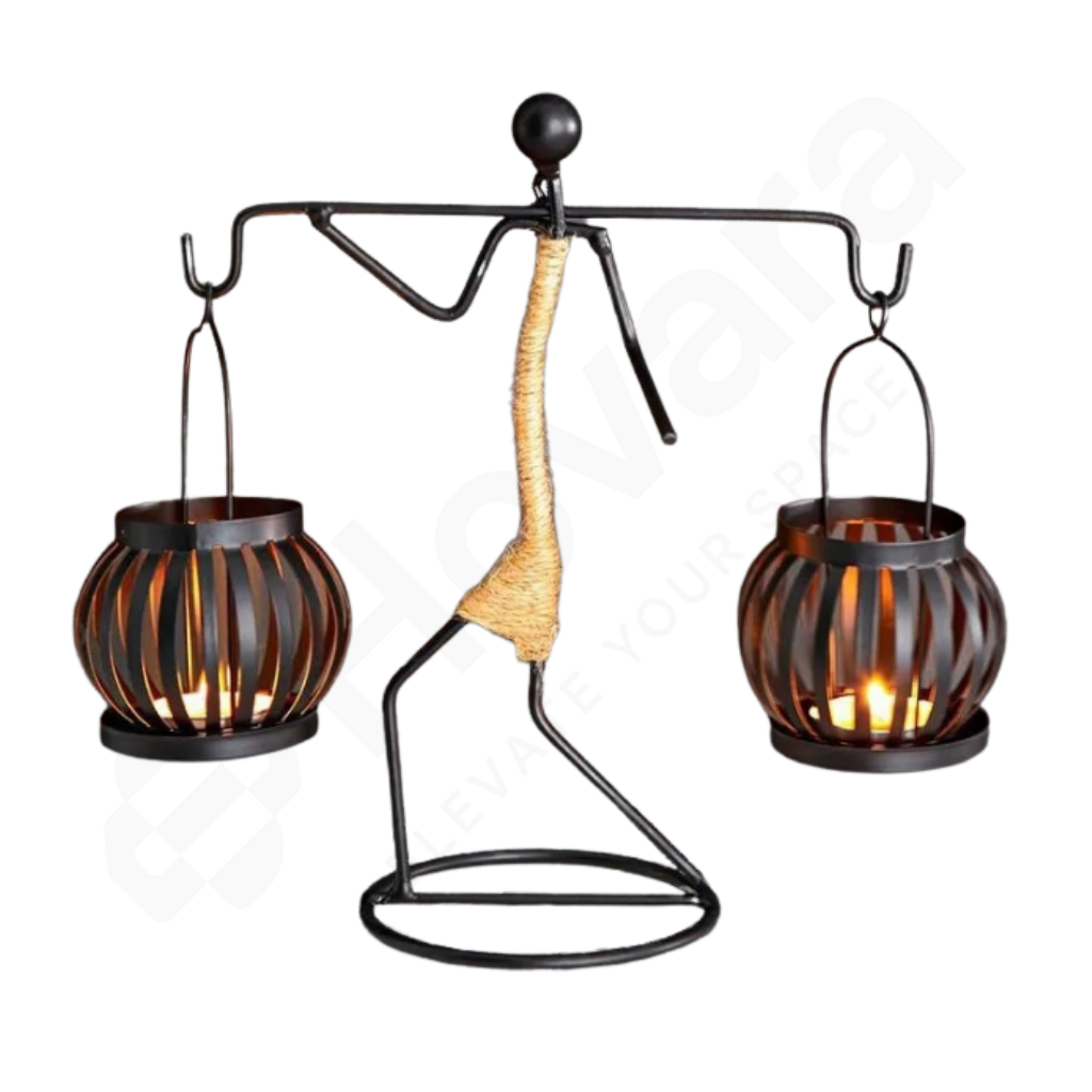 Decorative metal lantern with two lit candle holders on a white background