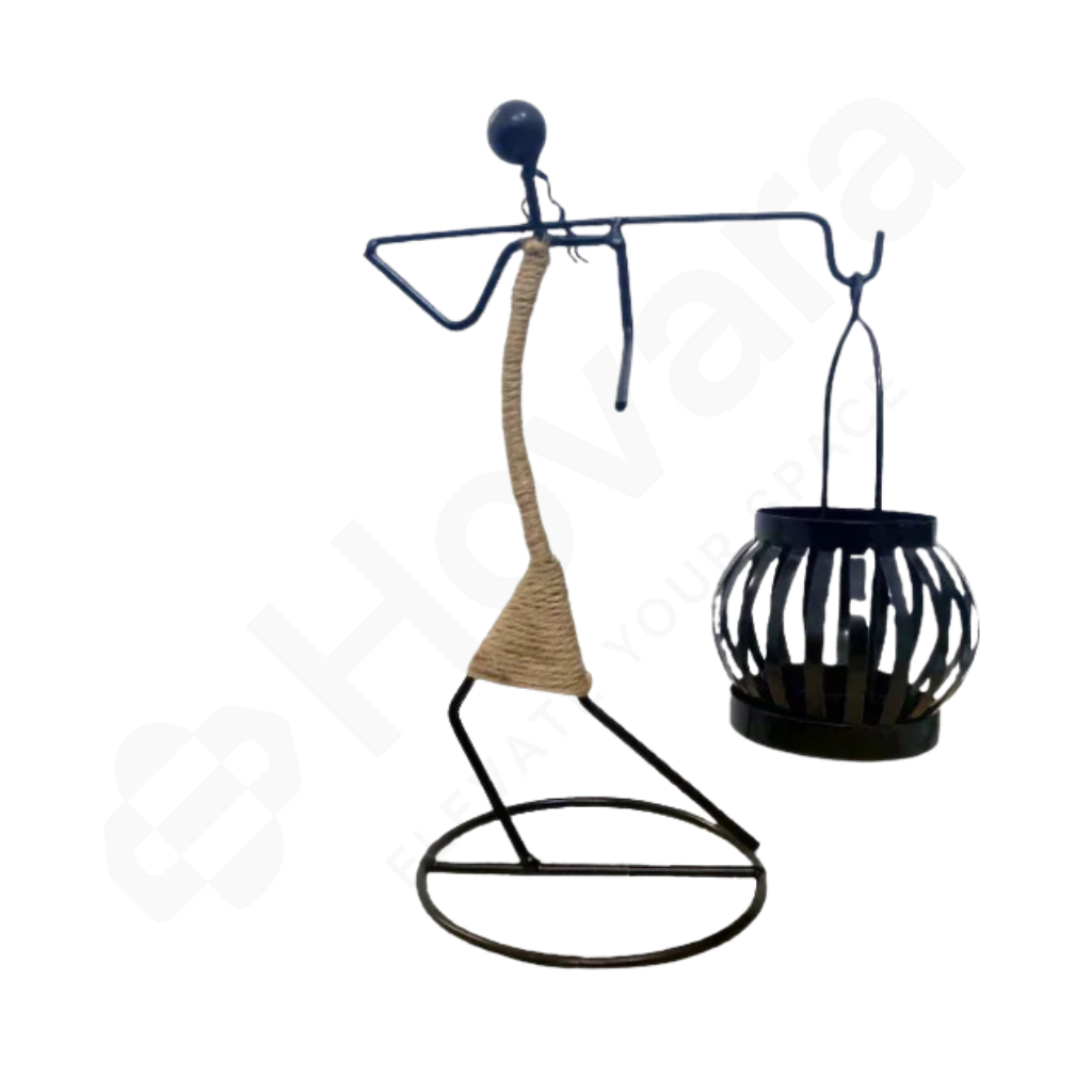 Decorative metal figure with a hanging lantern on a white background