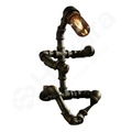 Decorative wall light fixture made of black metal pipes on a white background