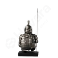 Statue of a warrior in armor holding a spear on a white background