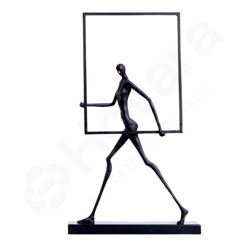 Black abstract sculpture of a figure holding a rectangular mirror on a white background
